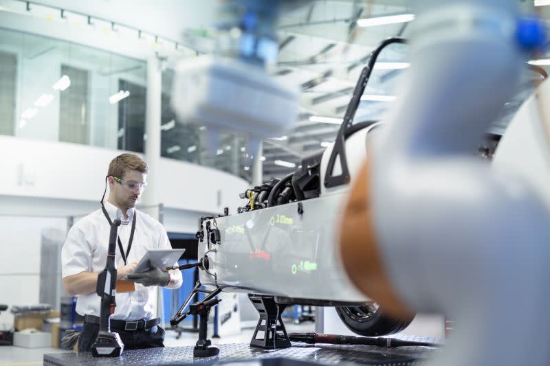 An engineer at work in robotics research facility. Photo: Monty Rakusen/Getty