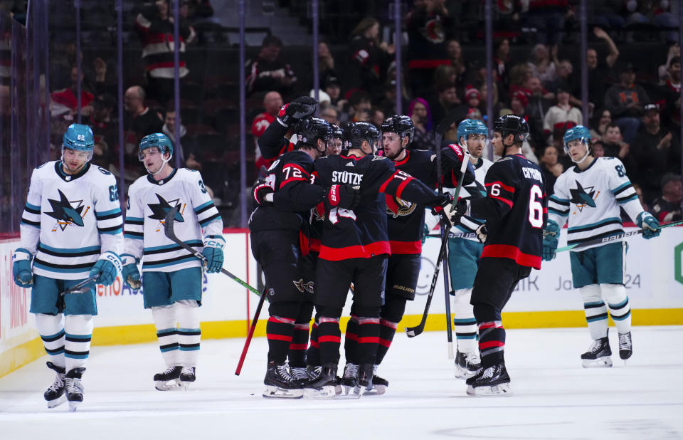 Ottawa Senators defenseman Thomas Chabot (72) celebrates his goal with teammates against the San Jose Sharks during the first period of an NHL hockey game, Saturday, Jan. 13, 2024 in Ottawa, Ontario. (Sean Kilpatrick/The Canadian Press via AP)