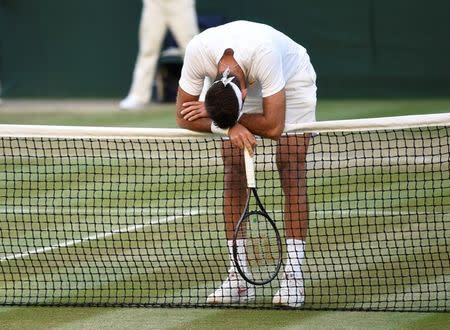 Tennis - Wimbledon - All England Lawn Tennis and Croquet Club, London, Britain - July 11, 2018 Argentina's Juan Martin Del Potro reacts during his quarter final match against Spain's Rafael Nadal REUTERS/Tony O'Brien