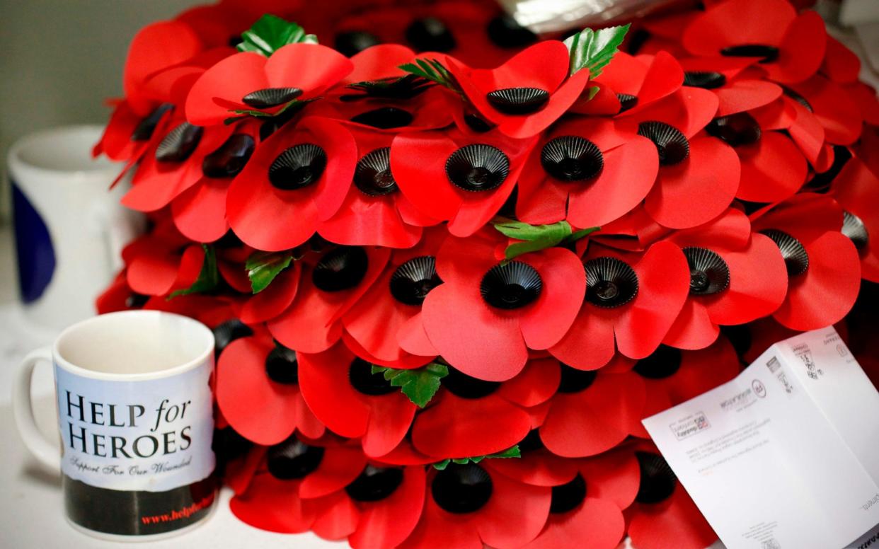 Poppy wreaths are piled on a work bench at The Poppy Factory in Richmond, west London on October 11, 2018 - AFP