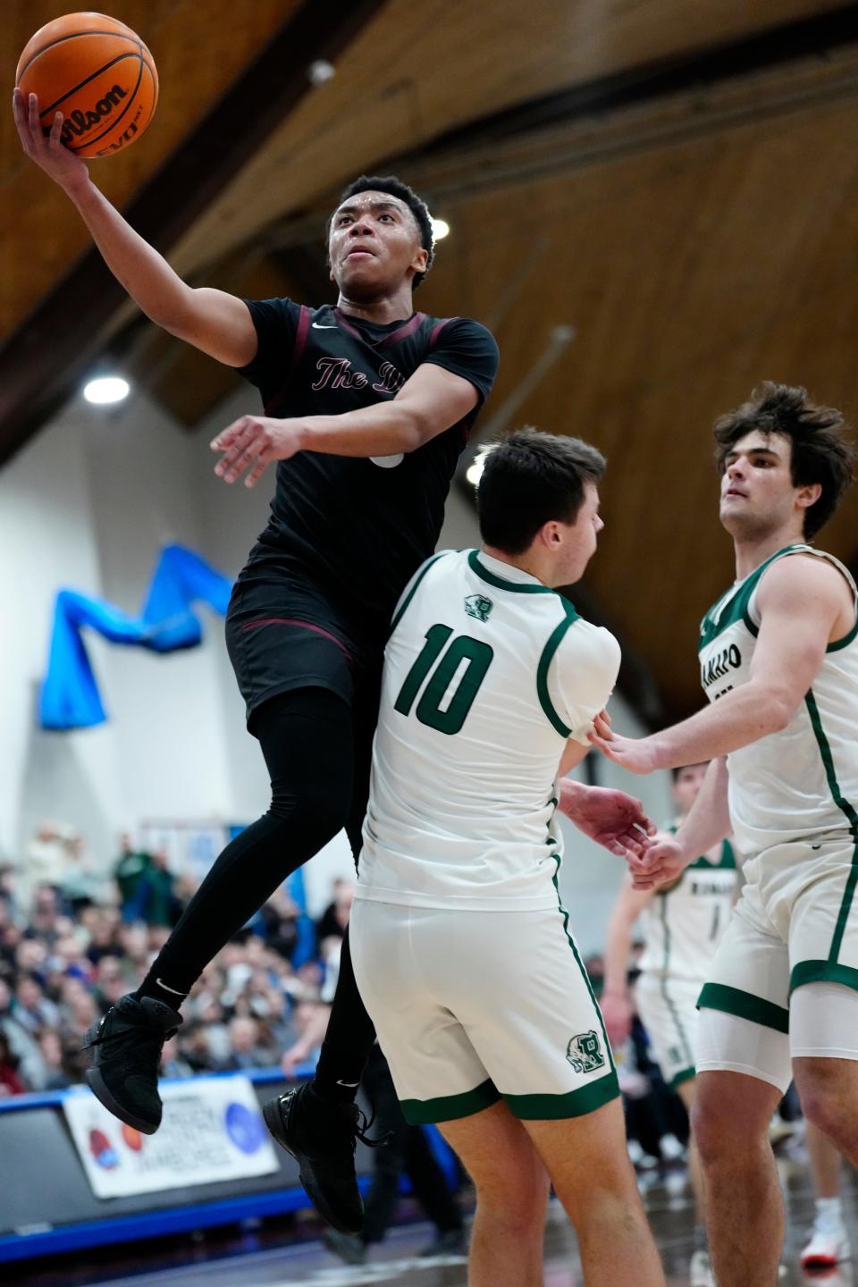 Isaiah Brown, of Don Bosco Prep, leaps over Peyton Seals, of Ramapo, during the Bergen County Jamboree, Sunday, February 18, 2024, in Hackensack.