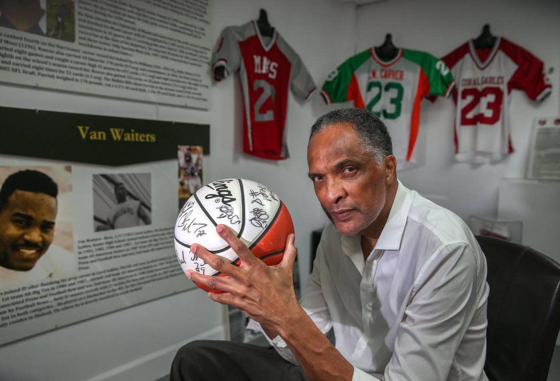 Anthony Witherspoon, a former college basketball player and coach, poses with a signed basketball at the soon-to-open Coconut Grove Sports Hall Of Fame, which he started to honor notable figures from the historically Black but rapidly gentrifying West Grove, where he was born and raised..