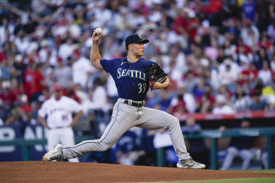 Seattle Mariners starting pitcher Bryan Woo delivers during the first inning of the team's baseball game against the Los Angeles Angels, Thursday, Aug. 3, 2023, in Anaheim, Calif. (AP Photo/Ryan Sun)