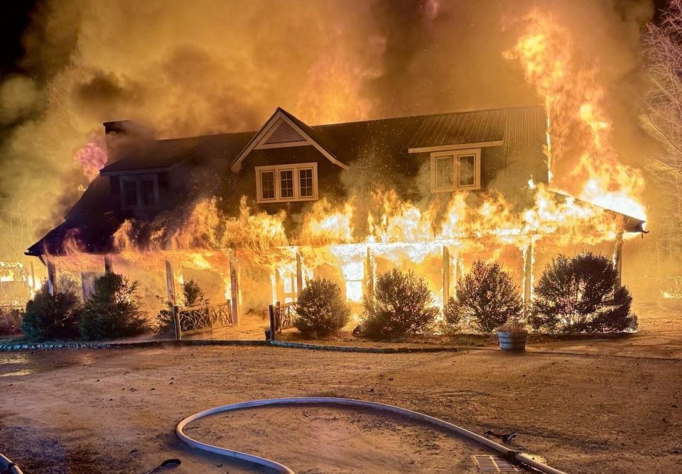 A building at Wayfarer Camp in Flat Rock is engulfed in flames on March 1.