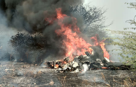 Smoke and fire billow after an Indian Air Force's Mirage 2000 trainer aircraft crashed in the southern city of Bengaluru, India, February 1, 2019. REUTERS/Ismail Shakil