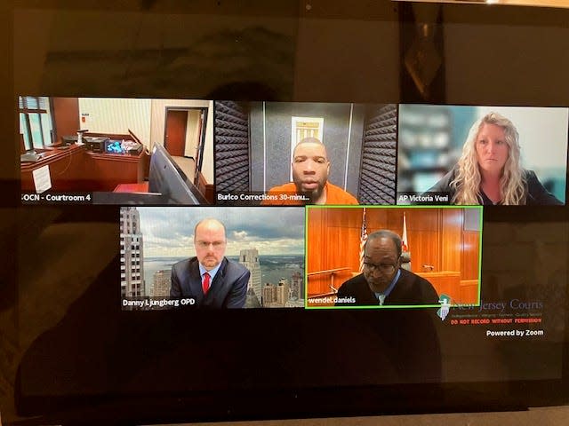 Quamel Benton, top center, appears at a virtual detention hearing in Ocean County Superior Court on April 10, 2024 before Judge Wendel E. Daniels, bottom right. Also appearing are Victoria Veni, assistant Ocean County prosecutor, top right, and Danny Ljungberg from the Ocean County Public Defender's Office, bottom left.