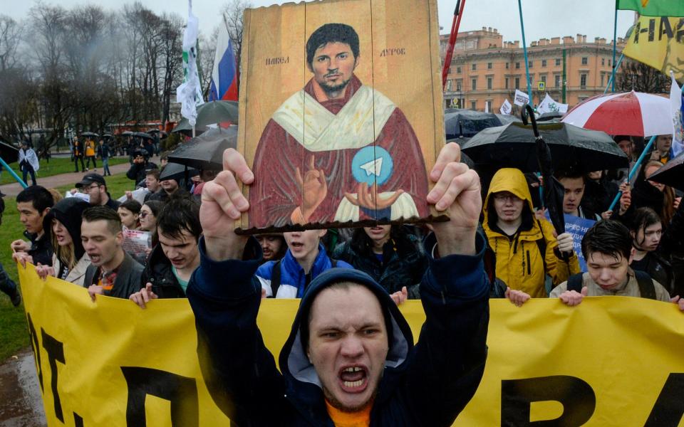 Demonstrators with a painting depicting Telegram's founder Pavel Durov protest against the blocking of the popular messaging app in Russia in 2018