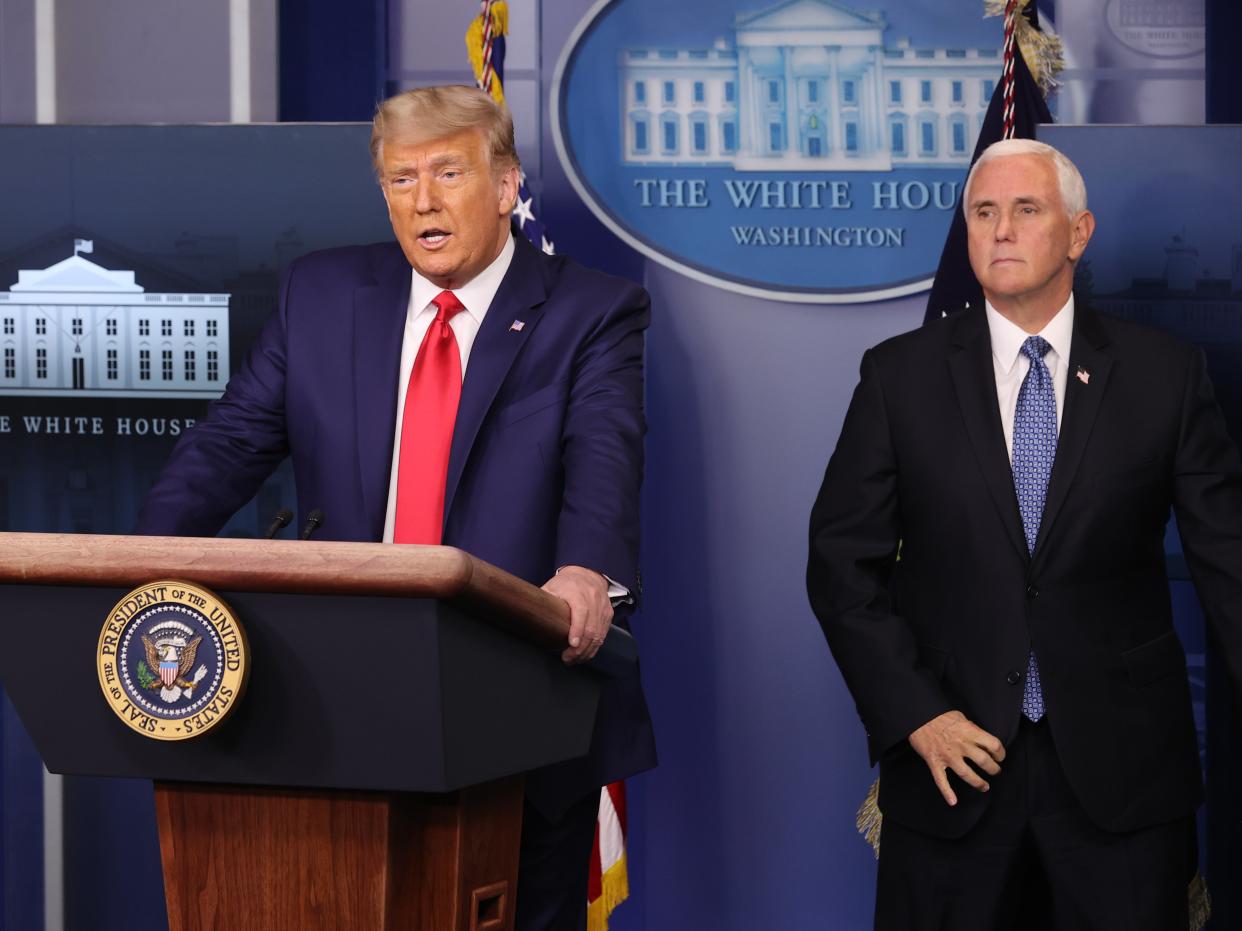 Donald Trump speaks as Mike Pence looks on in the James Brady Press Briefing Room at the White House on November 24, 2020.  (Getty Images)