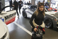 Hailie Deegan walks through her garage before the start of a practice session during testing for the upcoming Rolex 24 hour auto race at Daytona International Speedway, Friday, Jan. 3, 2020, in Daytona Beach, Fla. (AP Photo/John Raoux)