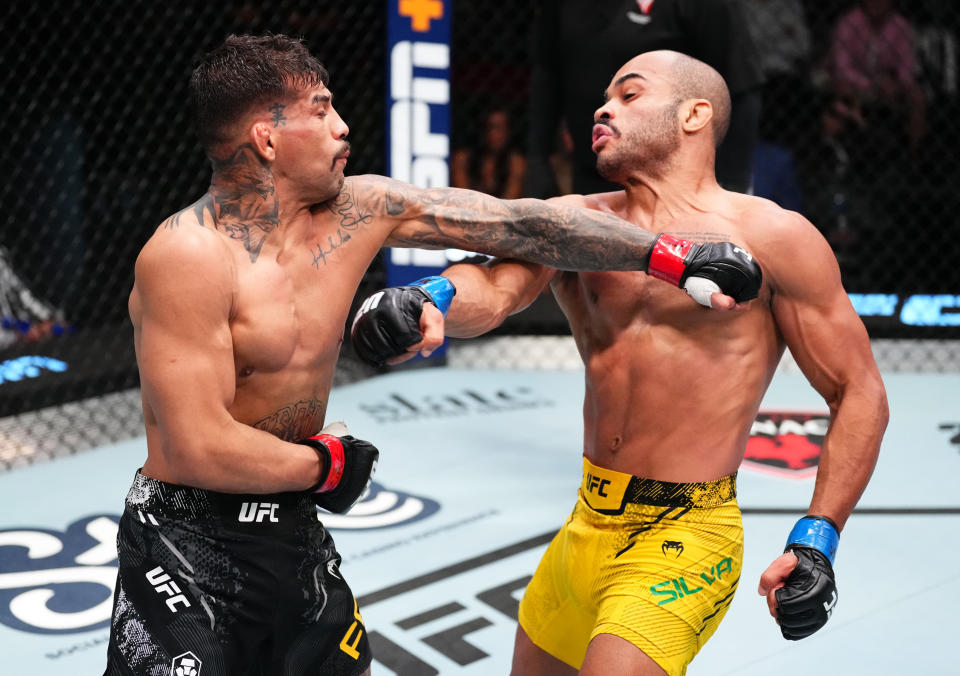 LAS VEGAS, NEVADA – APRIL 06: (L-R) Pedro Falcao of Brazil punches Victor Hugo of Brazil in a bantamweight fight during the UFC Fight Night event at UFC APEX on April 06, 2024 in Las Vegas, Nevada. (Photo by Jeff Bottari/Zuffa LLC via Getty Images)