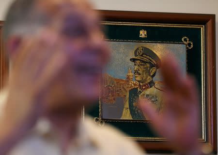 A photograph of late Egyptian President Anwar al-Sadat, hanging on the wall in Mohamed Anwar al-Sadat's office during his interview with Reuters in Cairo, Egypt June 28, 2017. REUTERS/Mohamed Abd El Ghany