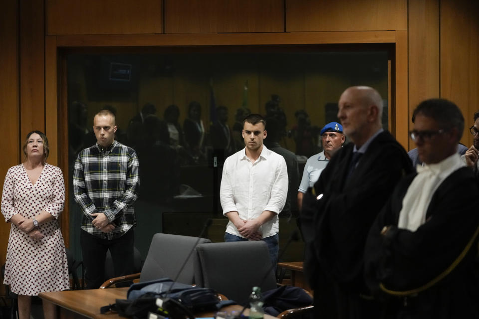 Finnegan Lee Elder, second from left, and Gabriel Natale Hjorth, third from left, listen to the reading of the judgment at the end of a hearing for the appeals trial in which they are facing murder charges for killing Italian Carabinieri paramilitary police officer Mario Cerciello Rega, in Rome, Wednesday, July 3, 2024. (AP Photo/Alessandra Tarantino)