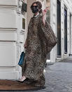 <p>Lady Gaga makes her way into her hotel in Rome on Wednesday, wearing her character Patrizia Reggiani's outfit from her upcoming film <em>Gucci</em>.</p>