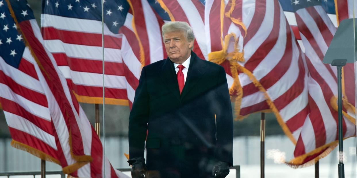 Trump in front of US flags on January 6