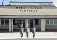 US airmen greet the plane of Chairman of the Joint Chiefs of Staff, US Marine Corps General Joseph Dunford, as he arrives on Wake Island in the Pacific during a visit on February 2, 2018