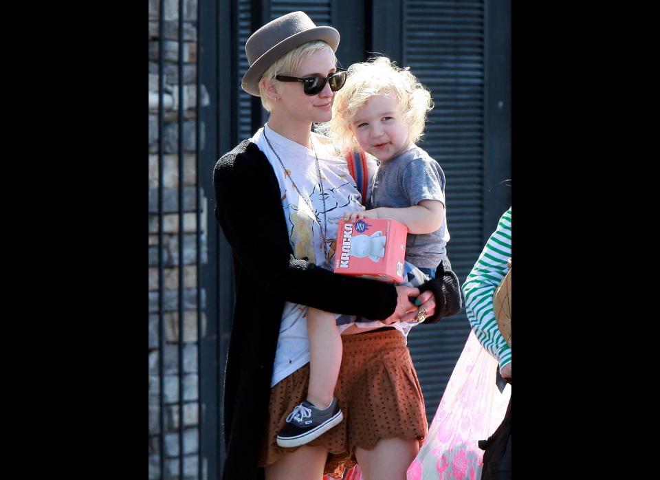 Ashlee Simpson shows off her stylish side in a mini skirt and hat as she carries her son Bronx through Studio City in Los Angeles.  