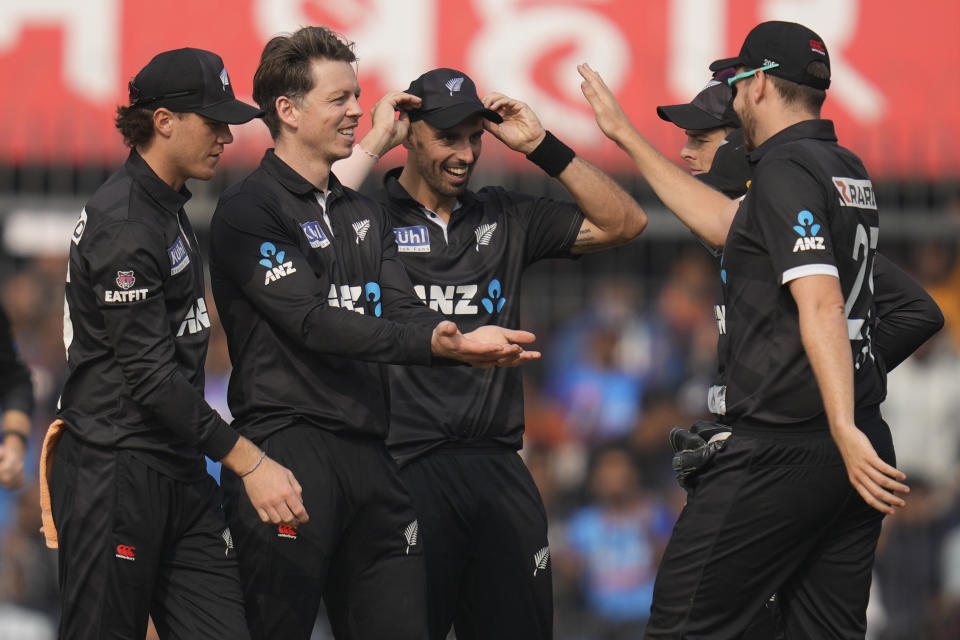 New Zealand's Michael Bracewell, second left, celebrates the wicket of India's captain Rohit Sharma during the third one-day international cricket match between India and New Zealand in Indore, India, Tuesday, Jan. 24, 2023. (AP Photo/Rajanish Kakade)