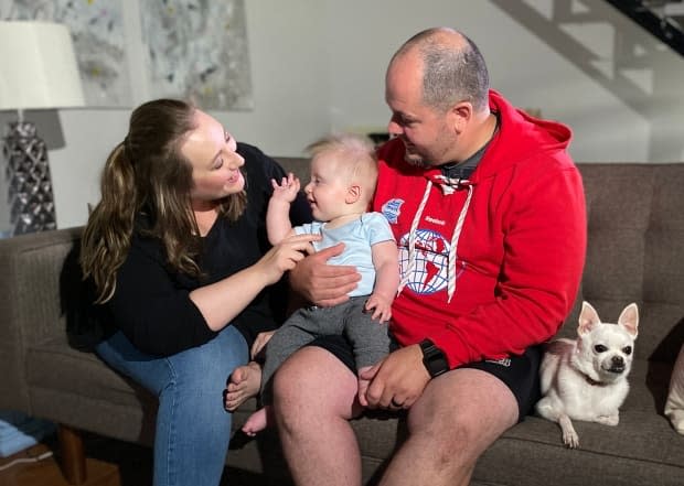 Six months after delivering Mac, Shaleen and Tom Erwin are breathing a sigh of relief. Both parents tested positive for COVID-19 while Shaleen was pregnant.  (Kirk Fraser/CBC - image credit)