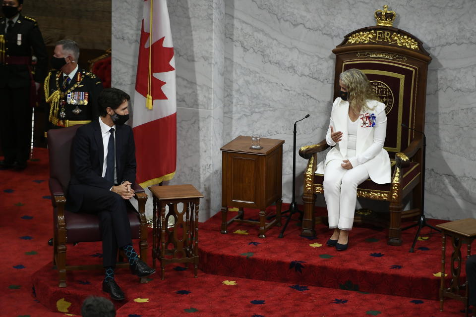 Prime Minister Justin Trudeau looks over at Gov.Gen. Julie Payette before she reads the speech from the throne in the Senate chamber in Ottawa, Wednesday, Sept. 23, 2020. (Justin Tang/The Canadian Press via AP)