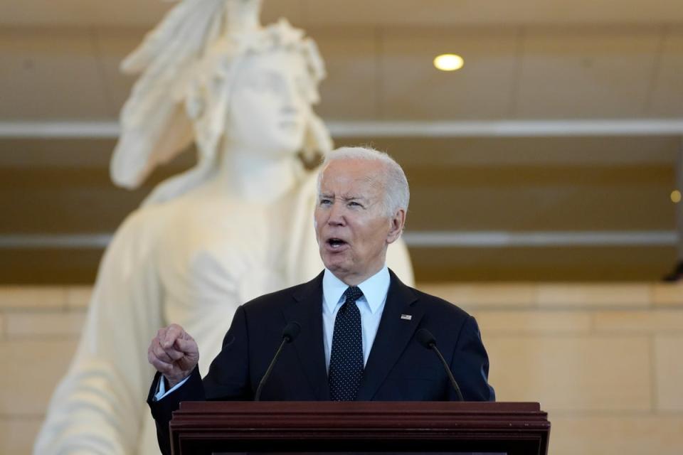 President Joe Biden, pictured speaking on 7 May 2024. A new report reveals his administration has indefinitely halted an investigation into potential Israeli war crimes (AP)