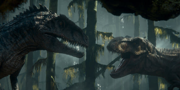 (from left) A Giganotosaurus and T. Rex in Jurassic World Dominion.