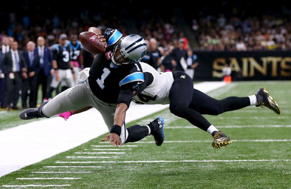 Cam Newton stretches for a touchdown against New Orleans (Getty Images)