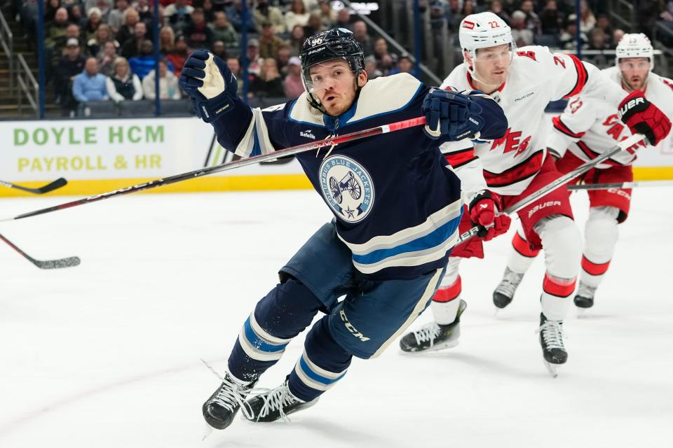 Feb 29, 2024; Columbus, Ohio, USA; Columbus Blue Jackets center Jack Roslovic (96) reacts to a puck in the corner during the first period of the NHL hockey game against the Carolina Hurricanes at Nationwide Arena.
