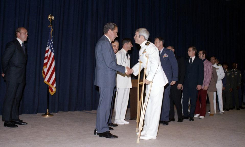 <p>President Richard Nixon shakes hands with McCain during a reception in Washington, D.C., on May 24, 1973. </p>