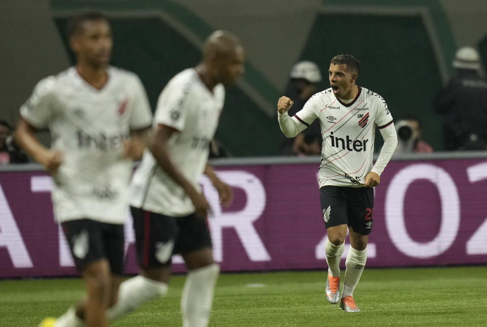Miguel Terans of Brazil's Athletico Paranaense, right, celebrates scoring his side's second goal against Brazil's Palmeiras during a Copa Libertadores semifinal second leg soccer match at Allianz Parque stadium in Sao Paulo, Brazil, Tuesday, Sept. 6, 2022. (AP Photo/Andre Penner)