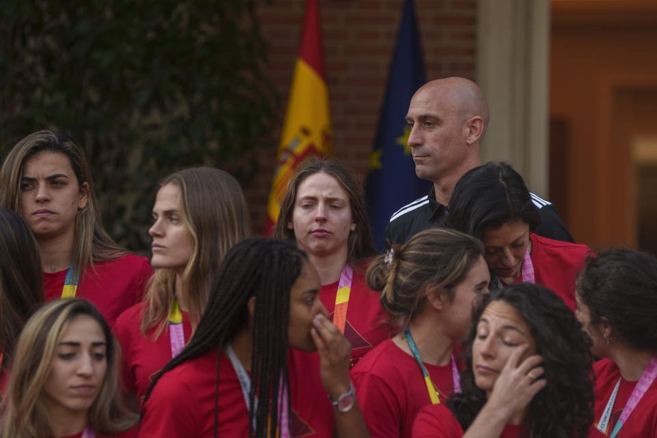 FILE - Then President of Spain's soccer federation, Luis Rubiales, top right, stands with Spain's Women's World Cup soccer team after their World Cup victory at La Moncloa Palace in Madrid, Spain, on Aug. 22, 2023. FIFA has banned ousted former Spanish soccer federation president Luis Rubiales from the sport for three years. He was judged for misconduct at the Women’s World Cup final where he forcibly kissed a player on the lips at the trophy ceremony. FIFA did not publish details of the verdict reached by its disciplinary committee judges. (AP Photo/Manu Fernandez, File)