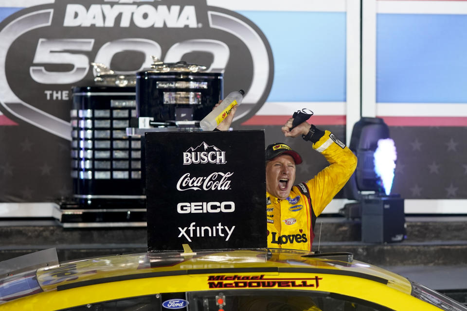 Michael McDowell celebrates after winning the NASCAR Daytona 500 auto race at Daytona International Speedway, Monday, Feb. 15, 2021, in Daytona Beach, Fla. (AP Photo/John Raoux)