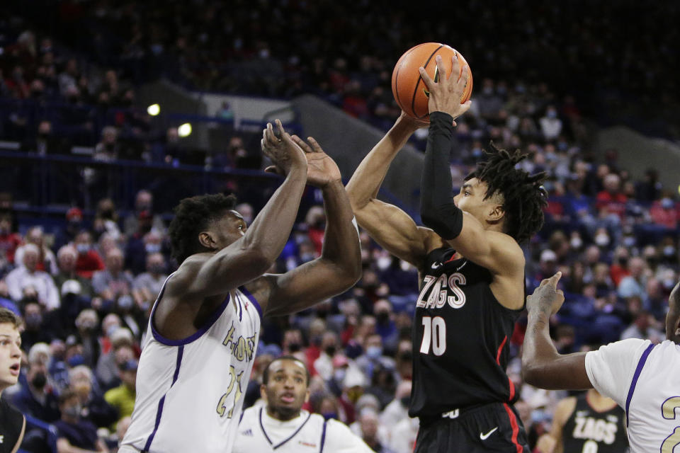 Gonzaga guard Hunter Sallis (10) shoots over Alcorn State forward Ladarius Marshall during the second half of an NCAA college basketball game, Monday, Nov. 15, 2021, in Spokane, Wash. (AP Photo/Young Kwak)