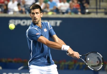 Jul 28, 2016; Toronto, Ontario, Canada; Novak Djokovic of Serbia plays a shot against Radek Stepanek of Czech Republic on day four of the Rogers Cup tennis tournament at Aviva Centre. Mandatory Credit: Dan Hamilton-USA TODAY Sports