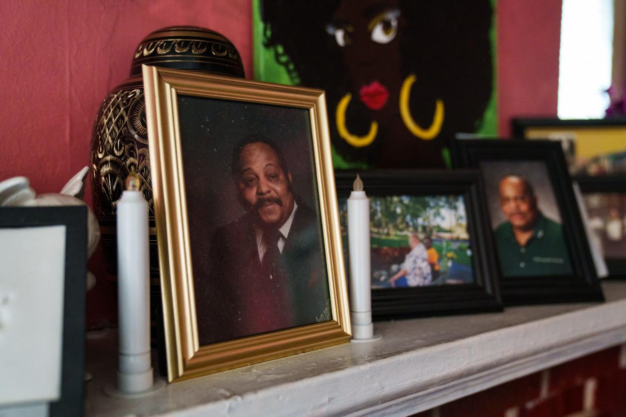 A photograph of David Leland Jones is displayed in front of his ashes in the home of his daughter, Tracey Pompey, in Richmond, Va.
