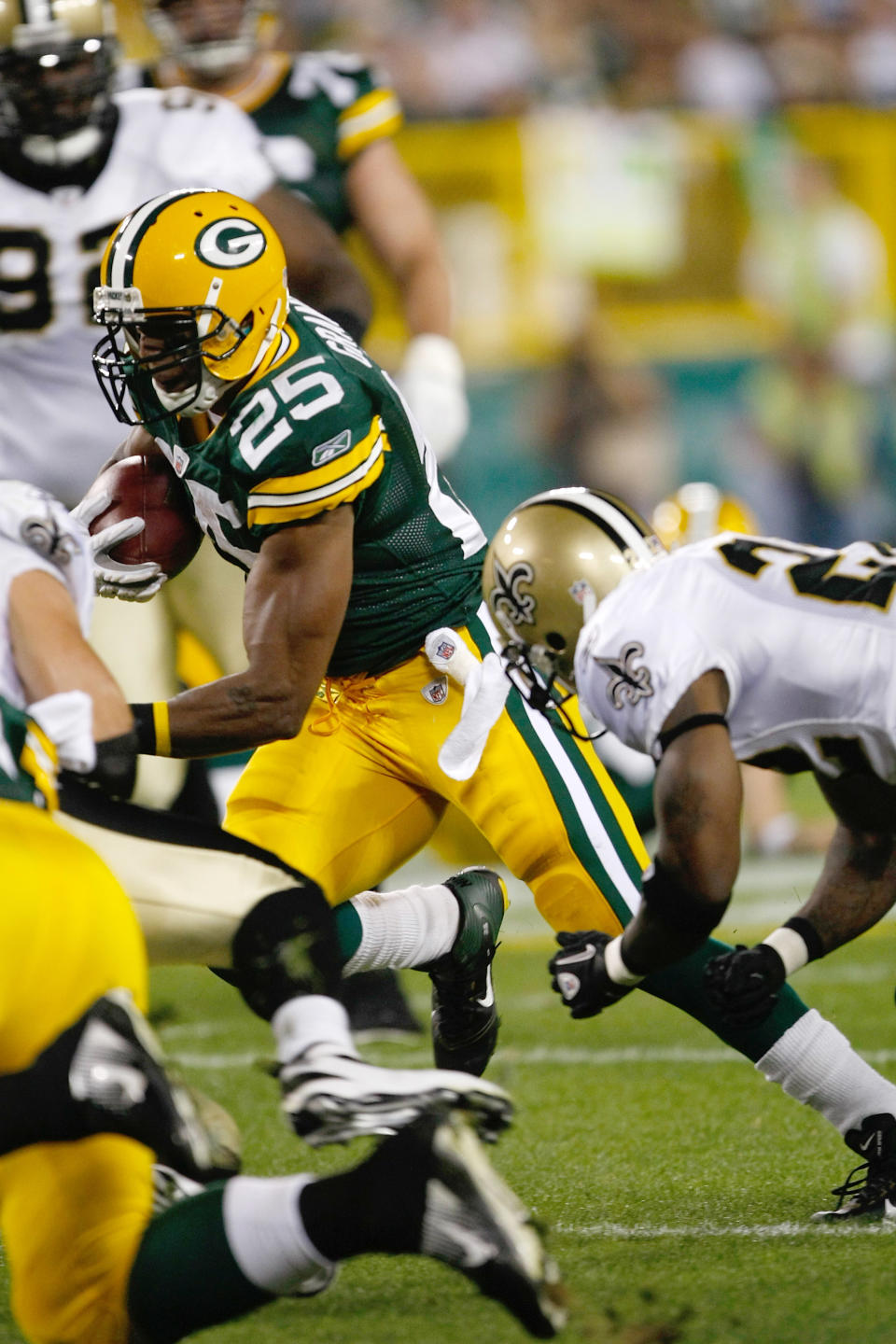 GREEN BAY, WI - SEPTEMBER 8: Ryan Grant #25 of the Green Bay Packers runs with the football during the game against the New Orleans Saints at Lambeau Field on September 8, 2011 in Green Bay, Wisconsin. The Saints defeated the Packers 42-34. (Photo by Scott Boehm/Getty Images)