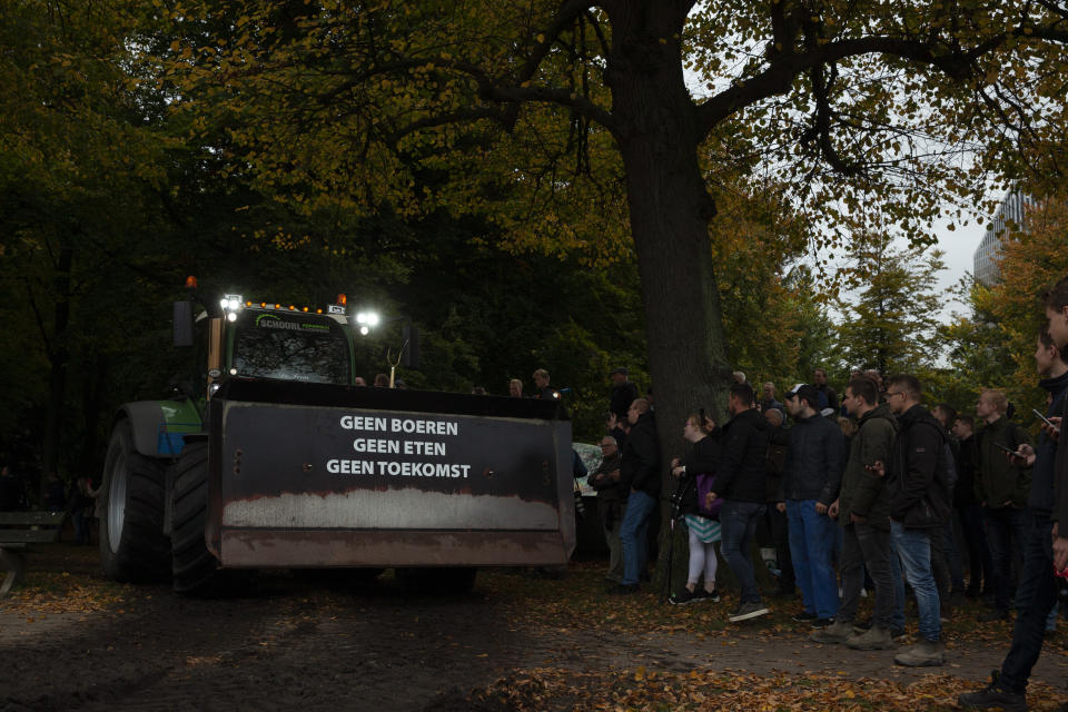 A tractor with a sign reading "No Farmers, No Food, No Future" takes part in a demonstration in The Hague, Netherlands, Wednesday, Oct. 16, 2019. Thousands of Dutch farmers protest over the Netherlands efforts to drastically reduce emissions of greenhouse gases. Among the farmers' demands are that the government does not further reduce the number of animals they can keep. (AP Photo/Peter Dejong)