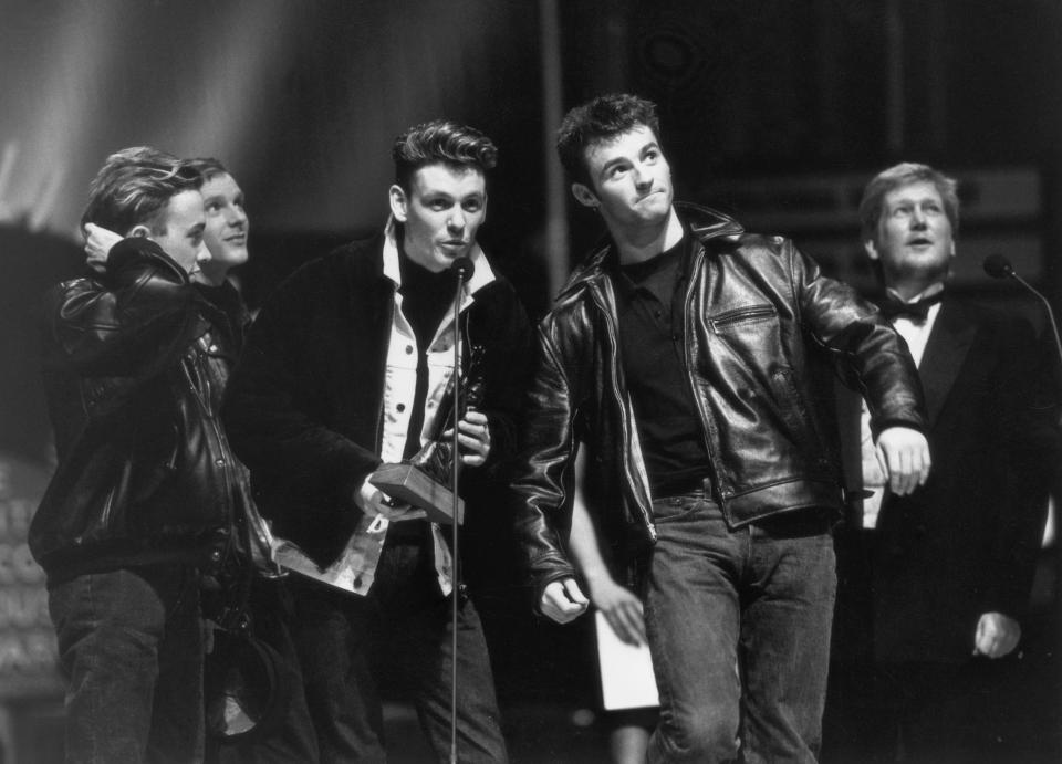 Scottish band Wet Wet Wet are voted Best British Newcomer at the Brit Awards, held at London's Albert Hall, 9th February 1988. From left to right, they are Neil Mitchell, Tommy Cunningham, Graeme Clark and Marti Pellow. (Photo by Dave Hogan/Hulton Archive/Getty Images)