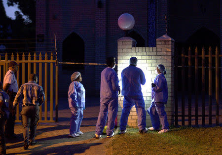 Police investigators collect evidence at a mosque where three men were attacked in Ottawa, South Africa, May 10, 2018. REUTERS/Rogan Ward