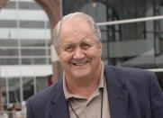 FILE - In this Aug. 10, 2006, file photo, Jim Houston, smiles as he walks through a reception for players being enshrined into the College Football Hall of Fame, in South Bend, Ind. Houston's widow would keep notes on her husband's deteriorating condition in a three-ring binder so she would be prepared for the day when he needed full-time care. (AP Photo/Joe Raymond, File)