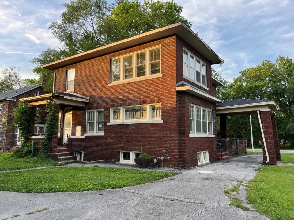 This side view of the home at 8300 W. Main St. in Belleville shows stained-glass windows and a porte cochere, an overhang that allowed people to exit vehicles in the circle driveway to exit under cover.