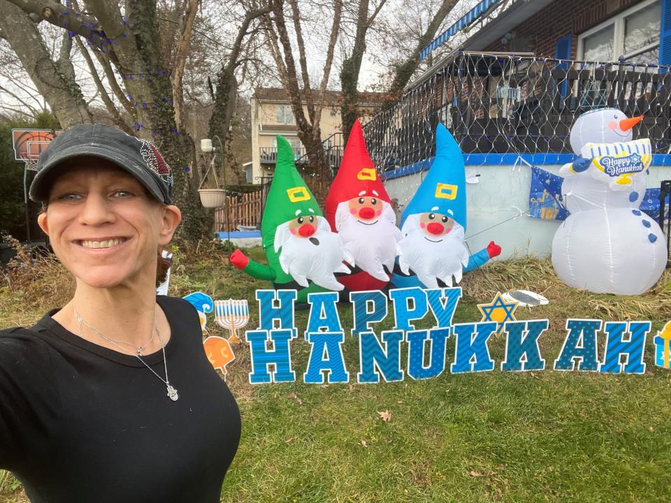 Beth Blank Dunn said she was thinking of her Jewish great grandfather and the Holocaust when she covered her Dobbs Ferry, N.Y., home in Hanukkah decorations and an Israeli flag after the Oct. 7 Hamas attack. "I made him a promise that I would never be silent."