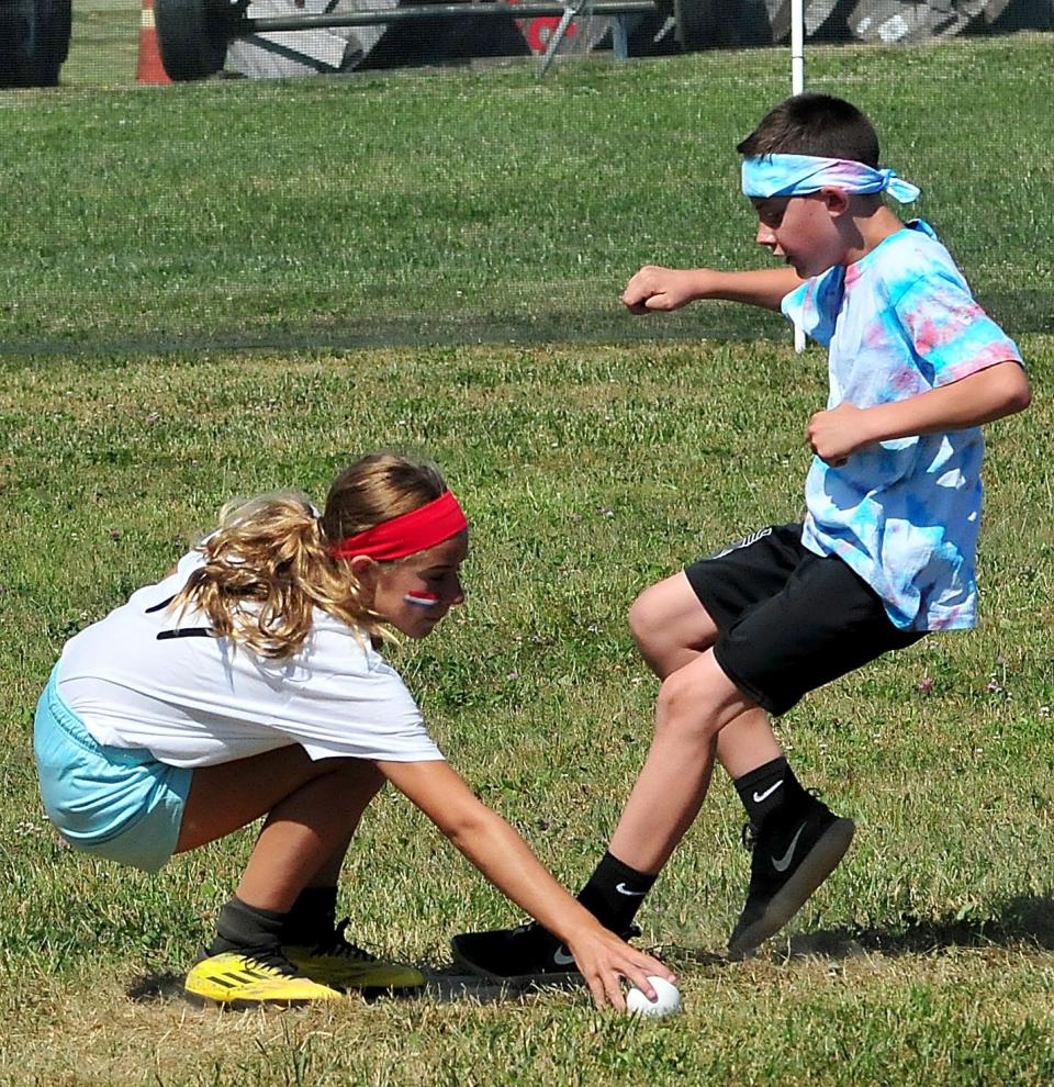 Warriors' Jason McClure reaches second base as Bomb Pops' Camryn Wires fields the ball during the Wifflefest XXIII elementary and middle school tournaments Saturday, July 2, 2022 at Southview Grace Brethren Church.