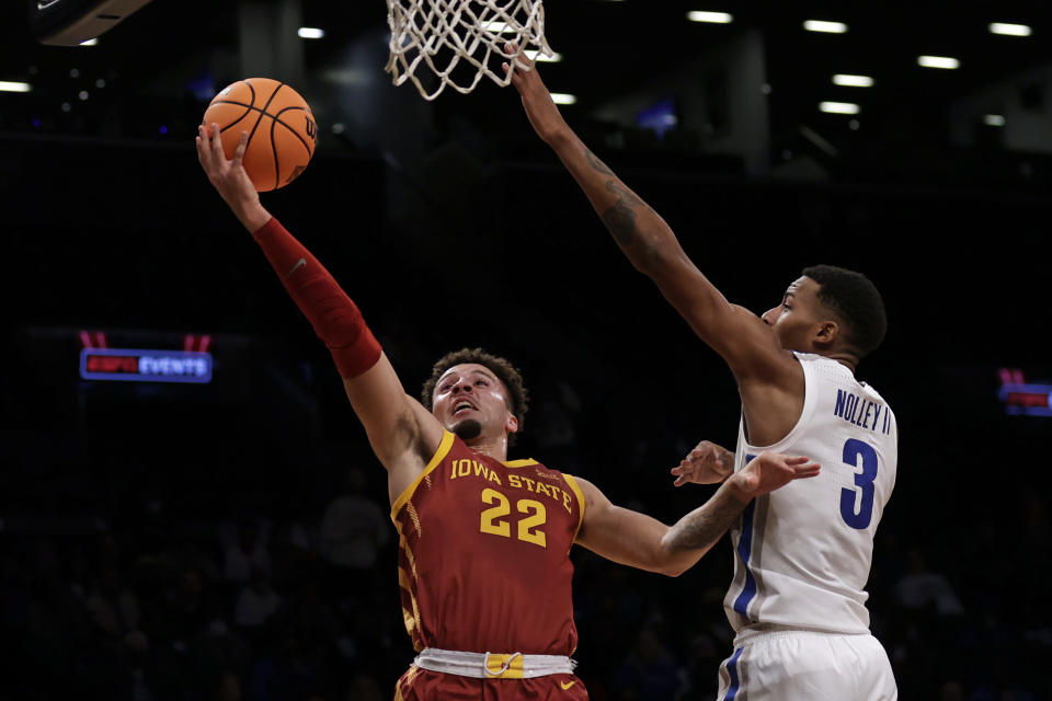 Iowa State's Gabe Kalscheur (22) drives to the basket past Memphis' Landers Nolley II (3) during the first half of an NCAA college basketball game in the NIT Season Tip-Off tournament Friday, Nov. 26, 2021, in New York. (AP Photo/Adam Hunger)