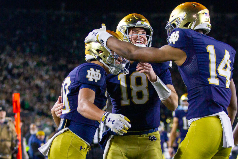 SOUTH BEND, IN - NOVEMBER 18: Jordan Faison #80, Steve Angeli #18, and Braylon James #14 of Notre Dame celebrate a touchdown during a game between Wake Forest University and University of Notre Dame at Notre Dame Stadium on November 18, 2023 in South Bend, Indiana. (Photo by Michael Miller/ISI Photos/Getty Images)