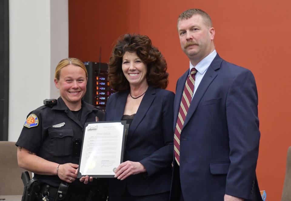 Lebanon City Patrolwoman Erin Secoges received a life-saving award, presented by Mayor Sherry Capello and Police Chief Bret Fisher, for her actions responding to a vehicle accident in June 2023.