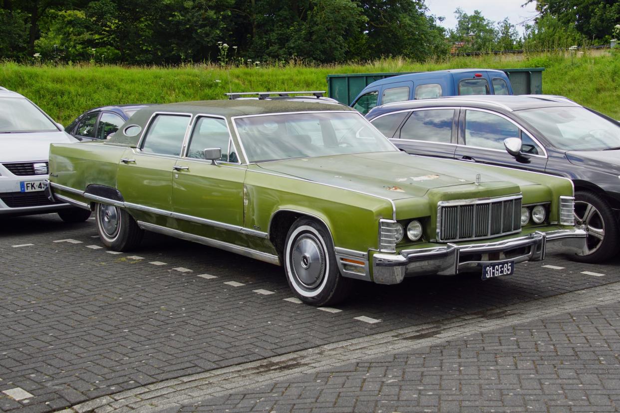 Pieterburen, the Netherland - July 16, 2020: Green Lincoln Continental parked on a public parking lot. Nobody in the vehicle.