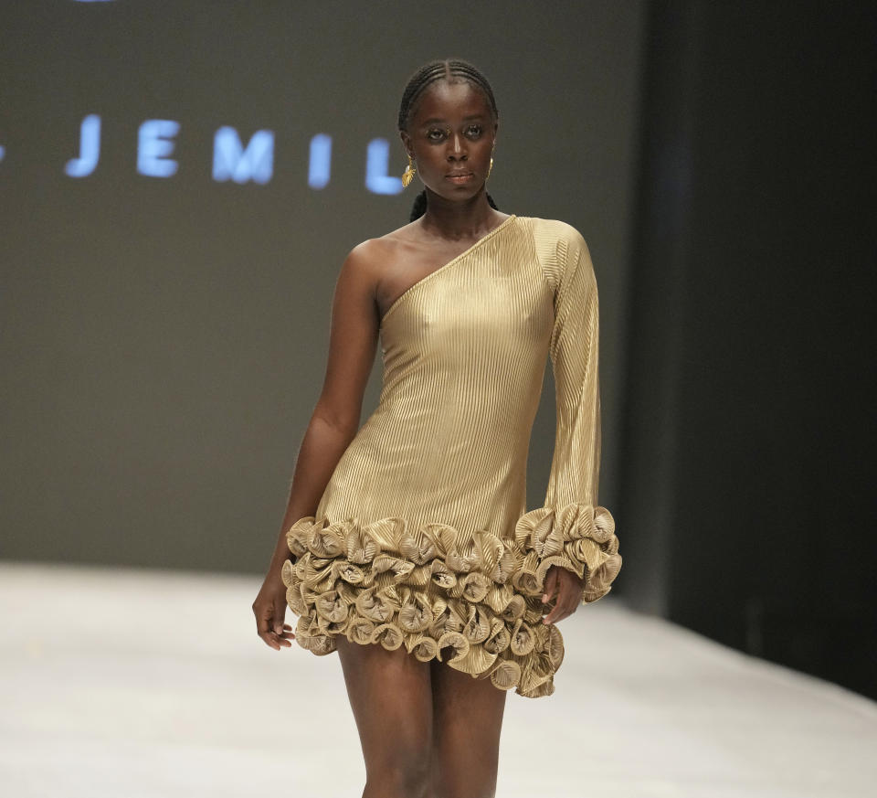 A model wears a creation by Jewel Jemila during the Lagos Fashion Week in Lagos, Nigeria, Thursday, Oct. 26, 2023. Africa's fashion industry is rapidly growing to meet local and international demands but a lack of adequate investment still limits its full potential, UNESCO said Thursday in its new report released at this year's Lagos Fashion Week show. (AP Photo/Sunday Alamba)