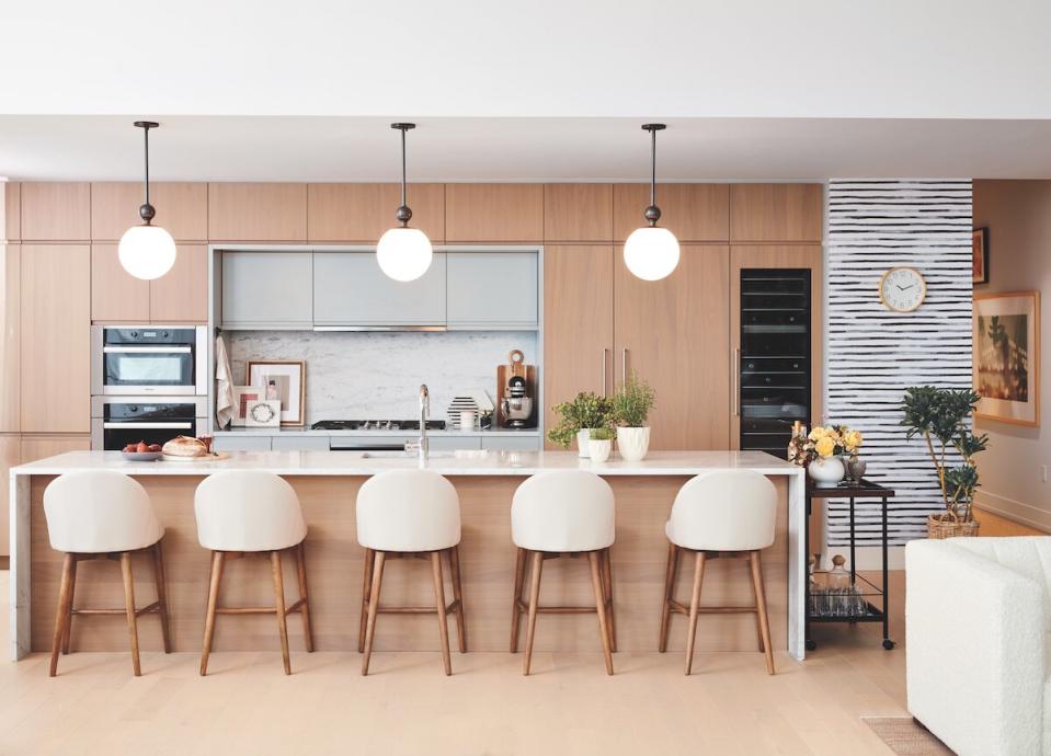 beautiful clean modern kitchen with bar stools