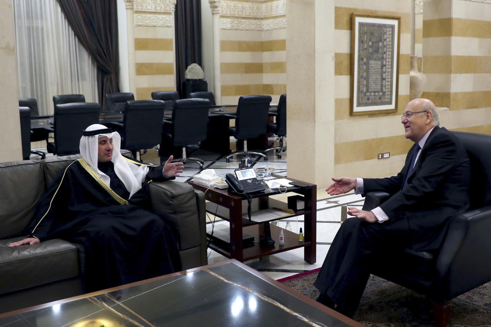 Lebanese Prime Minister Najib Mikati, right, meets with Kuwaiti Foreign Minister Sheikh Ahmad Nasser al-Mohammad al-Sabah in Beirut, Lebanon, Saturday, Jan. 22, 2022. Al-Sabah handed Lebanese officials Saturday a list of suggestions for confidence building measures with oil-rich gulf states after relations between the two sides deteriorated dramatically over the past months. (AP Photo/Bilal Hussein)