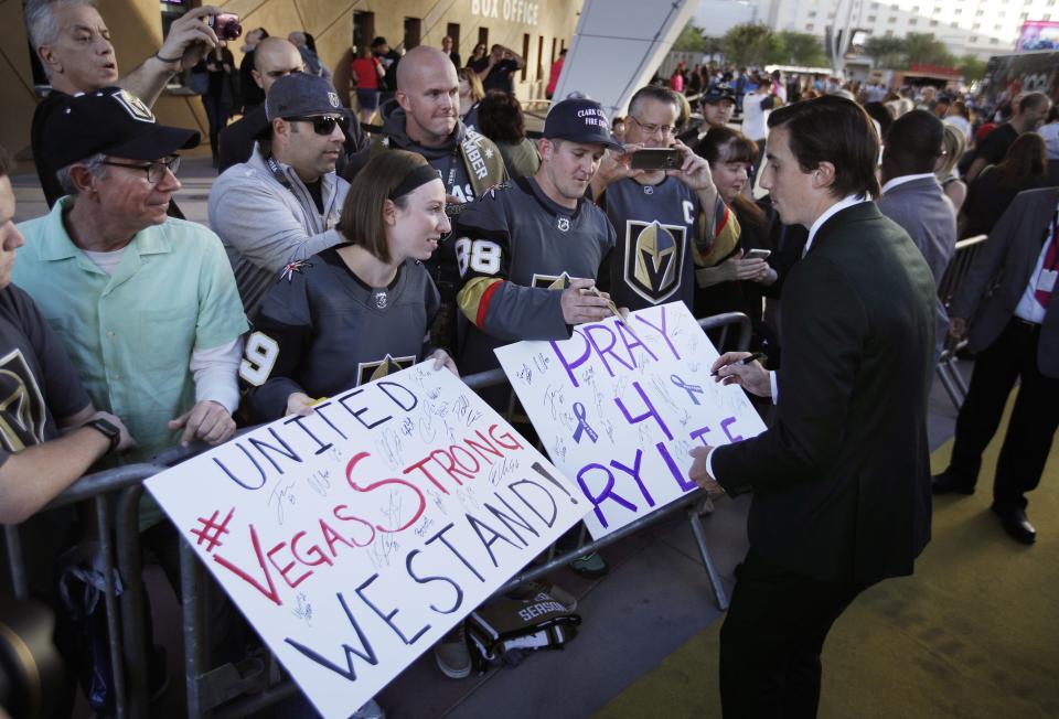 <p>Golden Knights players, including Marc-Andre Fleury (seen here), greet fans outside T-Mobile Arena ahead of their first home game. (John Locher/AP) </p>